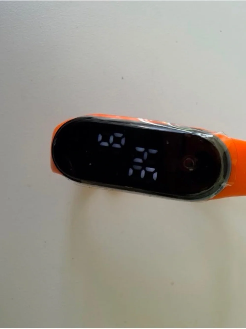 Replaceable Orange Silicone Smartwatch Band with Black Tracker Module